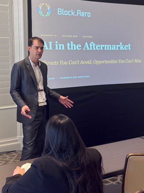 Todd Siena presenting in front of the title slide of Workshop 10, AI in the Aftermarket